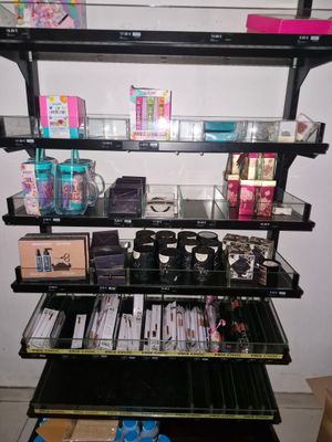 a shelf with cosmetics and other items on it