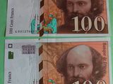 two bills with a picture of a man and a woman on them