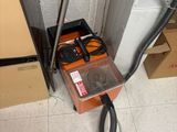 a box that is sitting on the floor next to a phone