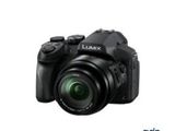 the front of a digital camera with a lens attached to it