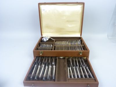 a wooden box with silverware in it on a white surface