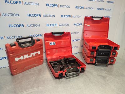 two red tool boxes sitting next to each other on top of a table