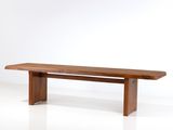 an image of a wooden bench against a white wall