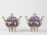 pair of blue and orange porcelain teapots with handles