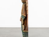 an image of a statue of an angel holding a book