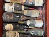 many bottles of wine sitting in a red box