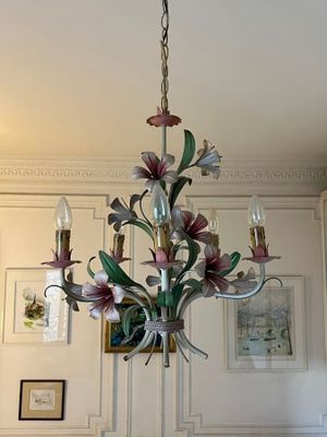 a chandelier hanging from the ceiling in a living room
