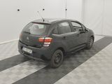 a picture of a small car parked in a garage