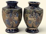 two vases sitting side by side on a white surface