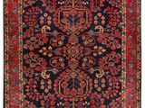 un tapis persan ancien aux couleurs rouges et bleues