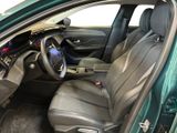 the interior of a green car with a steering wheel and a dashboard