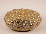 a gold colored glass bowl with small bubbles on it