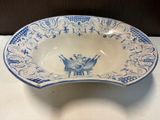 a blue and white bowl sitting on a table