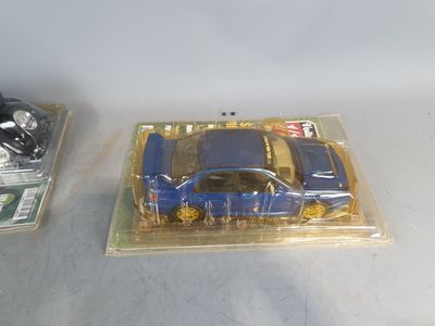 two toy cars that are sitting on a table