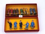 toy figurines in a red box on a white surface