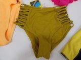 a pair of bikinis and a towel on a table