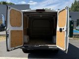 a white van that is parked in the parking lot