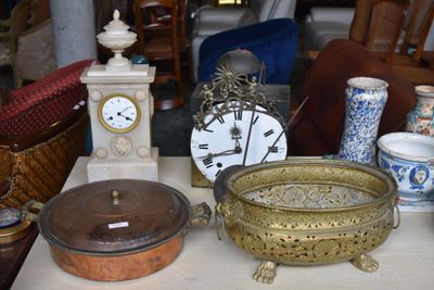 a table with a lot of antique items on it