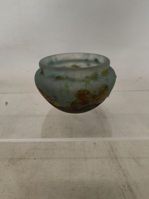 a glass bowl that is sitting on a table