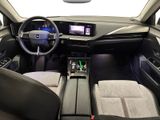 the interior of a car with a steering wheel, dashboard, and dashboard controls