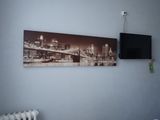 a picture of a picture hanging on the wall above a radiator