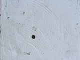 a white square with a hole in the middle of it