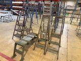 a lot of ladders that are sitting in a warehouse