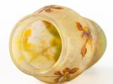 a yellow vase with a floral design on it