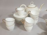 a lot of cups and saucers that are on the table