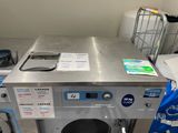 an image of a washing machine in a laundry room