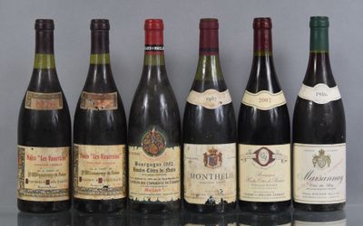 several bottles of wine are lined up on a table