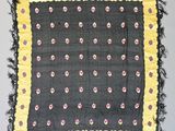 an image of a black and yellow scarf with flowers on it