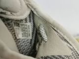 a close up of a pair of shoes on a white surface