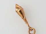 an image of a gold pendant with an eye on it