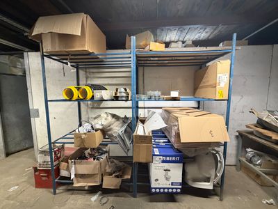 many boxes and boxes on the shelves in the room