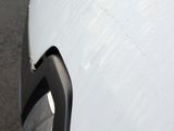 a close up view of a car ' s front bumper