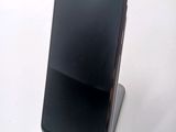 a cell phone that is sitting on top of a stand