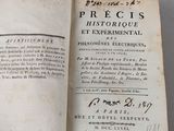 someone is holding a book open to a page of text