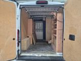 a white van that has some boxes in the back of it