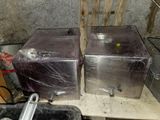 two metal appliances that are wrapped up and ready to be used