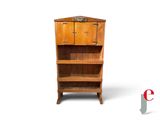 a wooden shelf with a cabinet on top of it