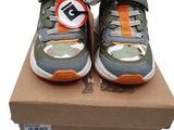 boys ' s shoes in a box on a white background