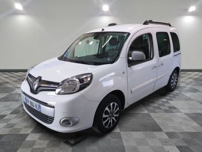the white van is parked on a checkered floor in a garage