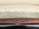 a couch that is sitting on a black cushion