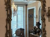 a mirror hanging on the wall in a room