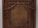an old wooden easel with a wooden frame on top of it