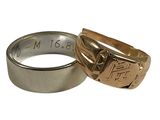 two wedding rings that are sitting next to each other