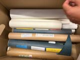 a person holding a piece of paper in a box