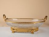 an image of a gold and crystal bowl sitting on a table