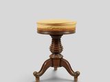 un petit tabouret en bois surmonté d'un coussin jaune